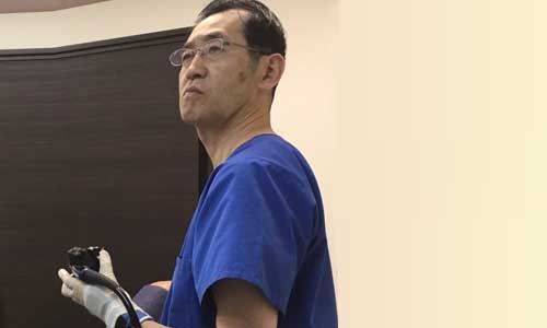 Doctor in surgical scrubs at the clinic